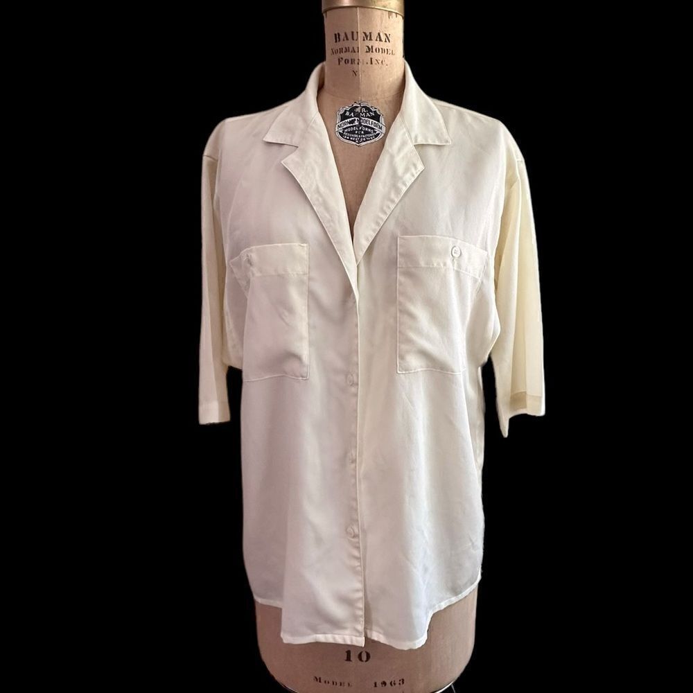 Features Short sleeve cream crepe blouse size 12